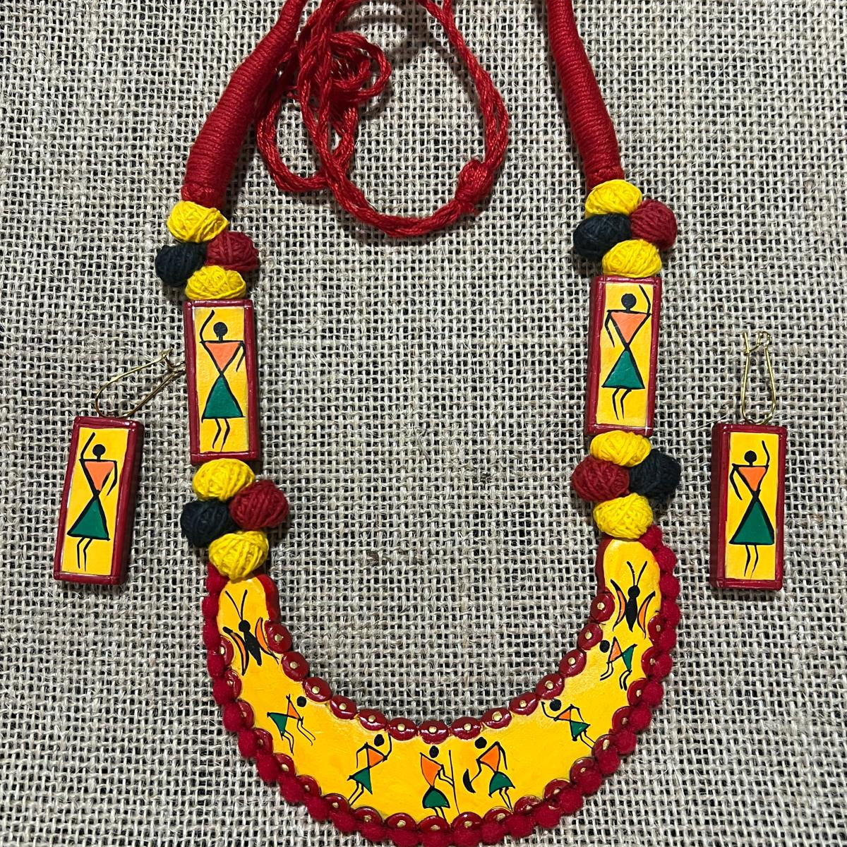 Warli Dance Delight: Red & Yellow Terracotta Jewelry Set with Tribal Art