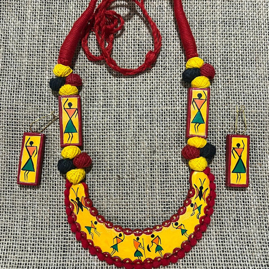 Warli Dance Delight: Red & Yellow Terracotta Jewelry Set with Tribal Art